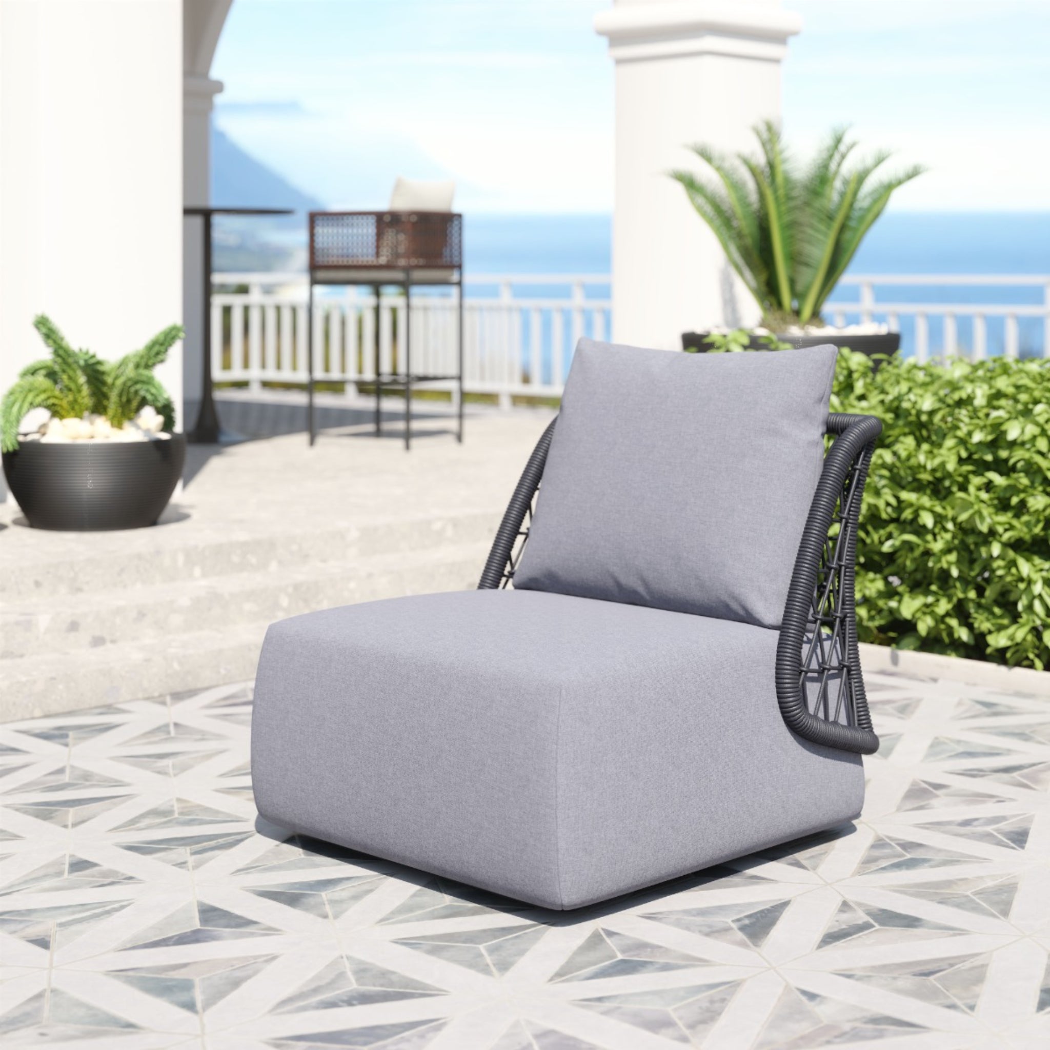 Gray-outdoor-chair-with-pillow-and-woven-backrest-on-patterned-tiles-near-garden---productpage---