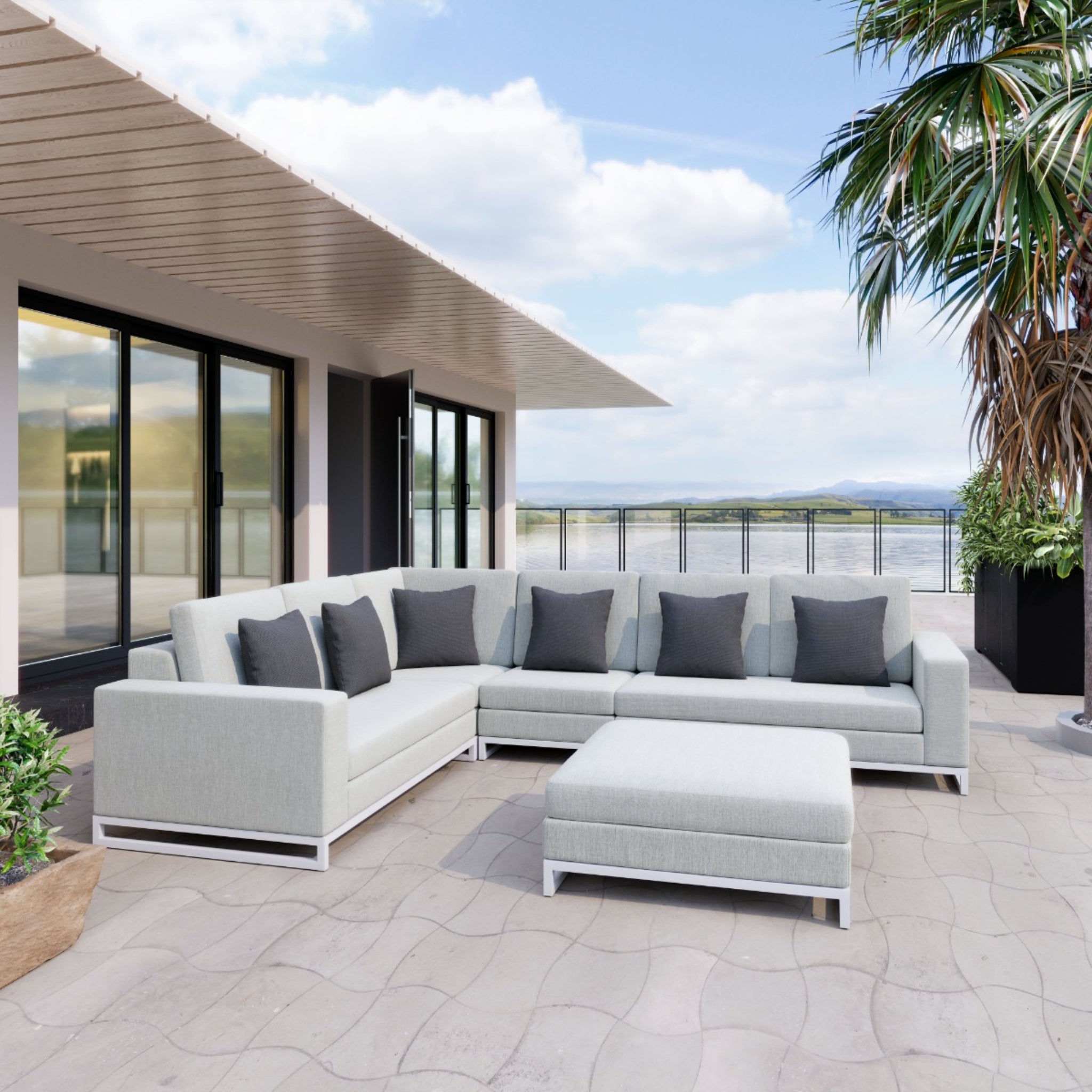 Light-gray-sectional-sofa-with-dark-cushions-on-patio-overlooking-water-view---productpage---