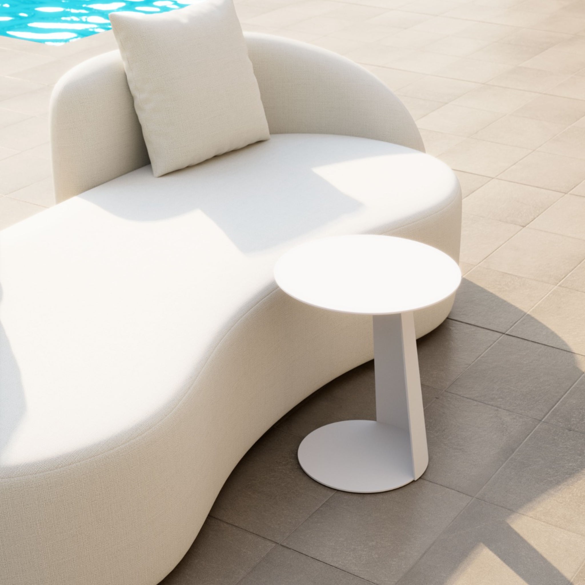 Modern-white-round-table-next-to-curved-sofa-by-the-pool---productpage---