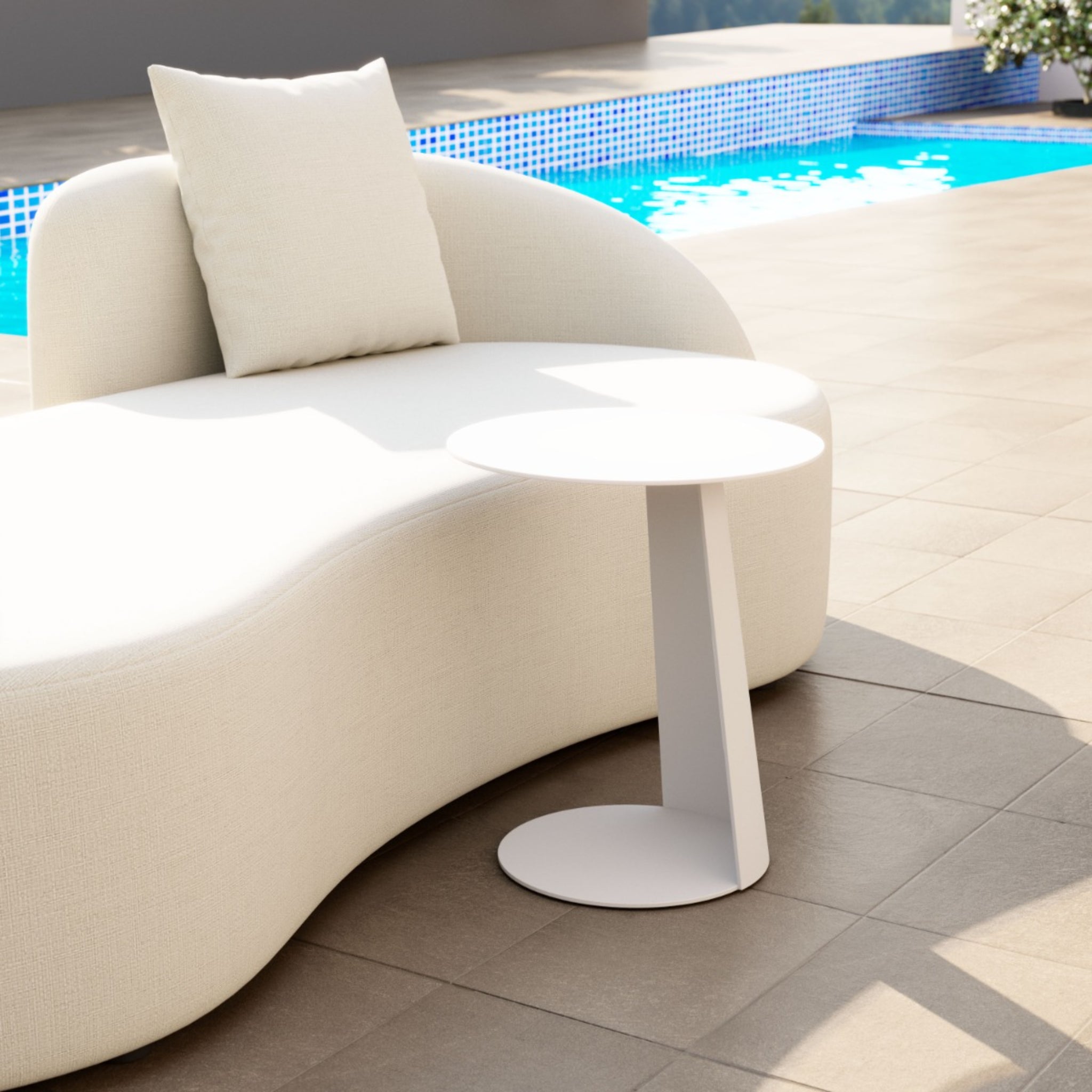 Contemporary-white-curved-sofa-with-round-table-in-poolside-setting---productpage---