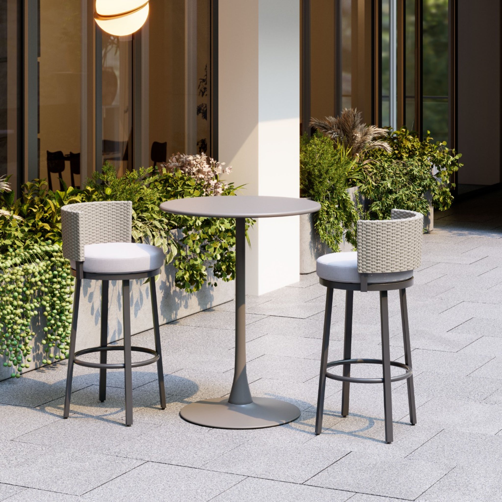 Cozy-outdoor-patio-with-a-round-gray-table-and-beige-woven-bar-stools-greenery-background---productpage---