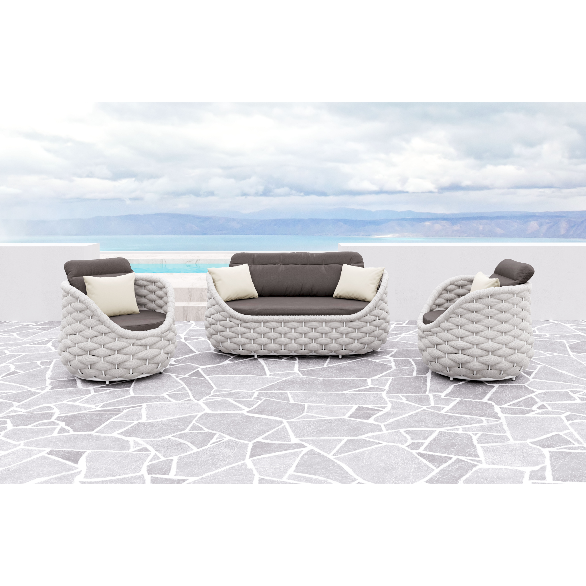 Gray-woven-patio-furniture-set-with-contrasting-cushions-on-tiled-floor-with-sea-and-mountain-background---productpage---