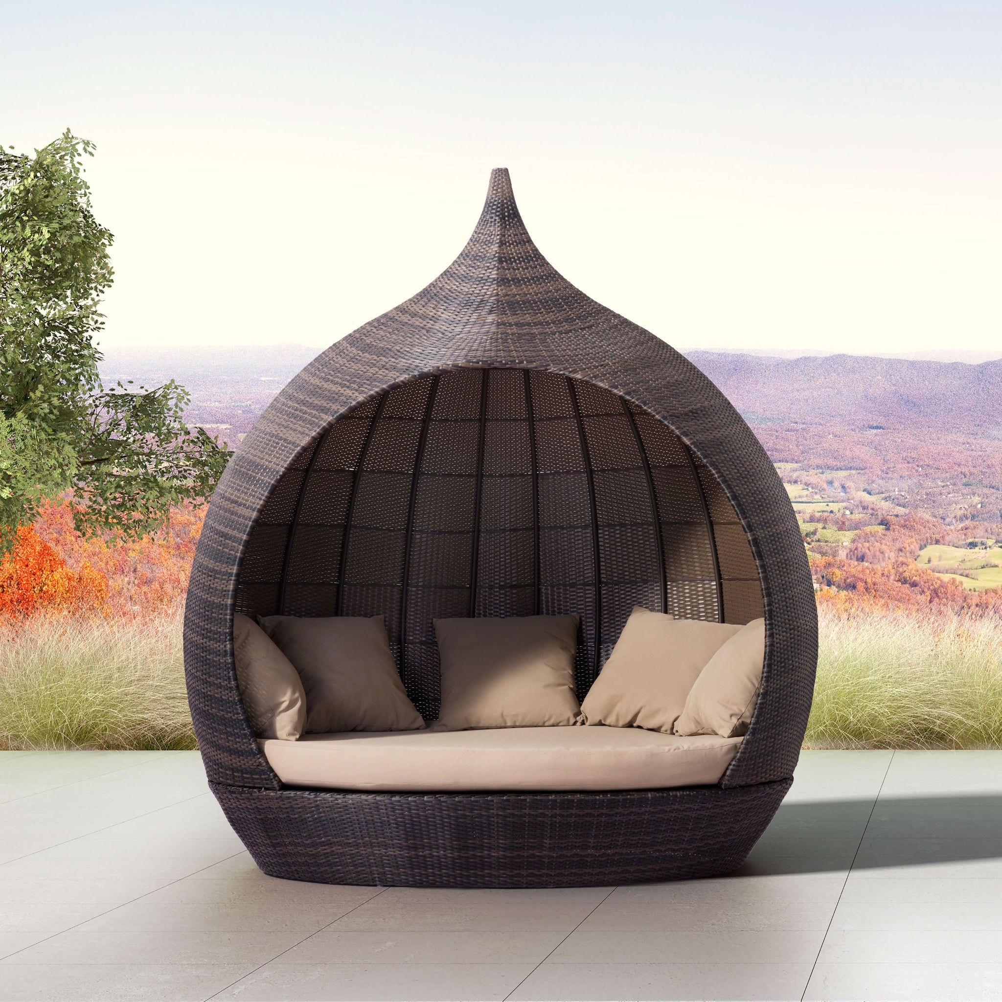 Elegant-rattan-pod-daybed-with-pillows-in-outdoor-setting-with-mountain-view---productpage---