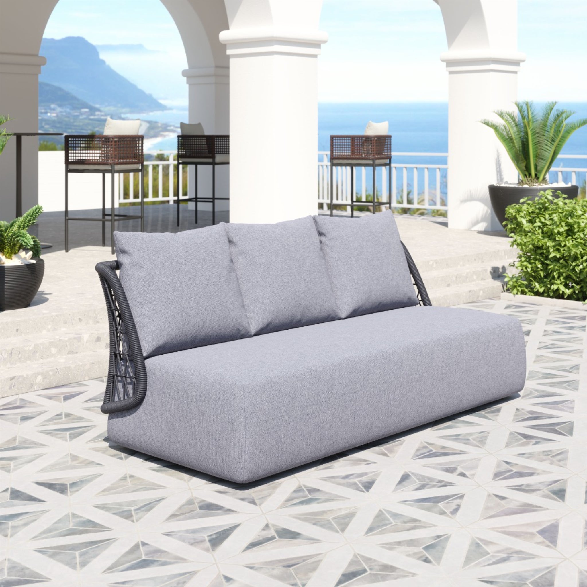 Grey-sofa-with-pillows-in-outdoor-setting-overlooking-ocean-and-arches---productpage---