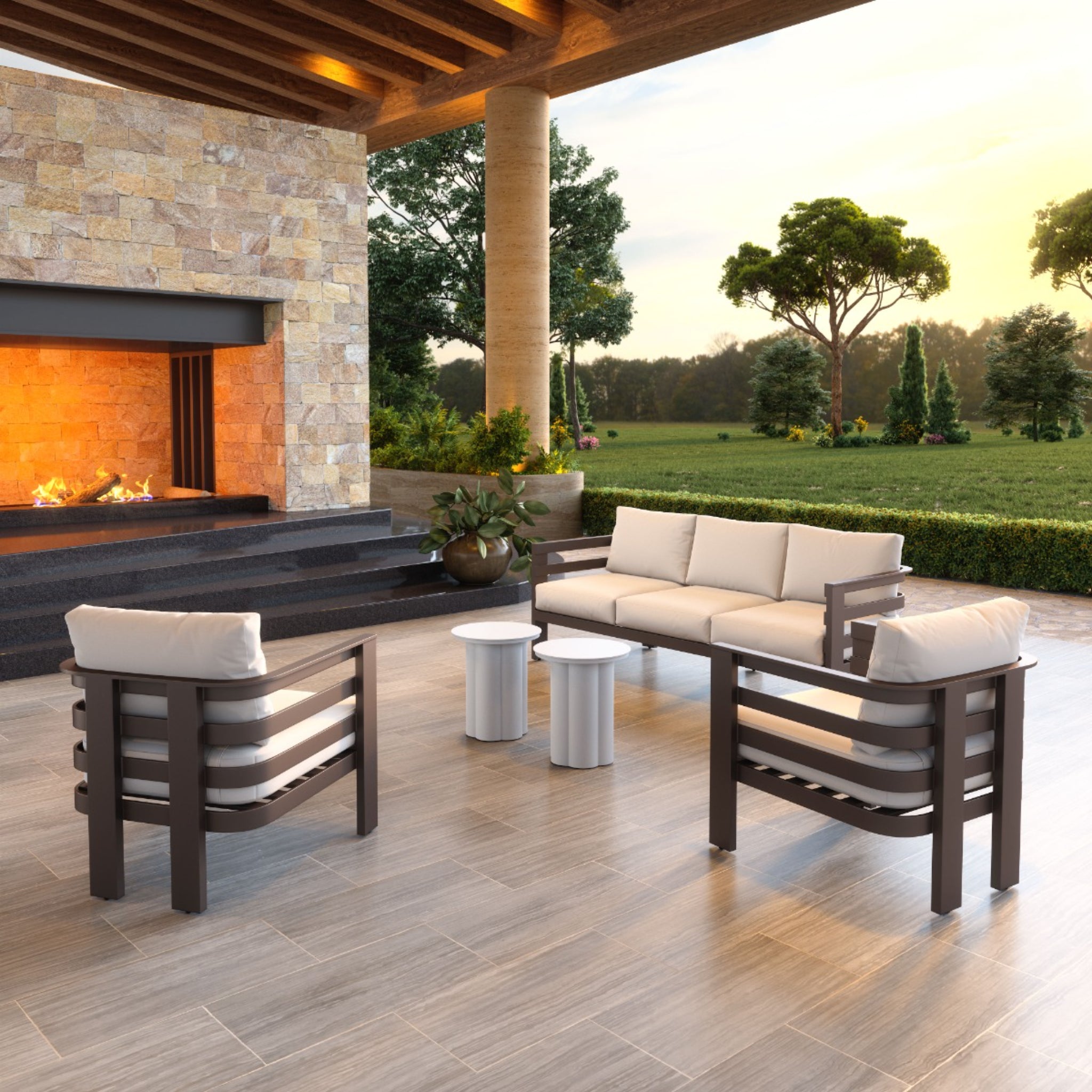 a-product-page-with-an-outdoor-seating-area-featuring-a-modern-sofa-and-armchairs-with-white-cushions-near-a-fireplace