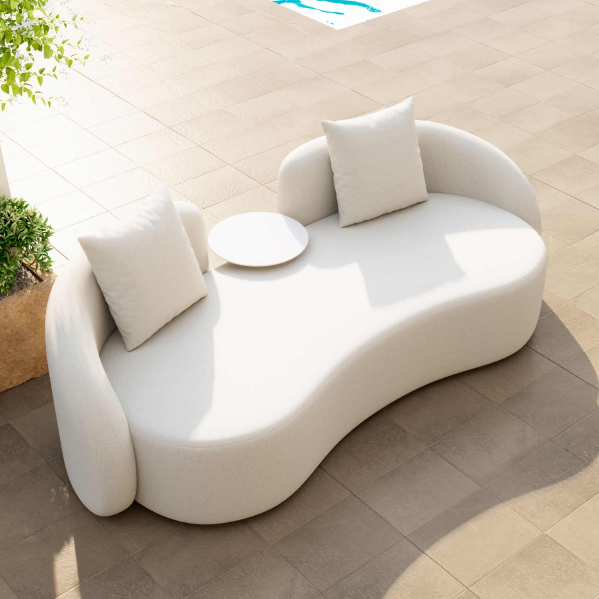 Top-view-of-light-beige-curved-loveseat-with-pillows-and-small-table-on-terrace---productpage---